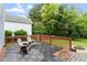 Relaxing outdoor deck with modern tile flooring, providing a perfect spot for enjoying the fresh air and peaceful views at 1217 Heritage Greens Dr, Wake Forest, NC 27587