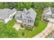 Charming two-story home featuring well-manicured lawn, lovely porch, and attached garage on a lush landscaped lot at 1217 Heritage Greens Dr, Wake Forest, NC 27587