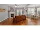Cozy living room with fireplace flows into the dining area and offers outdoor access at 1217 Heritage Greens Dr, Wake Forest, NC 27587