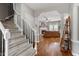 Inviting living room with fireplace and hardwood floors is open to the foyer and stairway at 1217 Heritage Greens Dr, Wake Forest, NC 27587