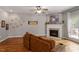 Relaxing living room offers a fireplace and backyard access for indoor and outdoor living at 1217 Heritage Greens Dr, Wake Forest, NC 27587
