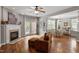 Open concept living and dining areas feature a fireplace and access to backyard patio at 1217 Heritage Greens Dr, Wake Forest, NC 27587