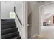 Dark wood staircase leads to a bonus room featuring carpet flooring and gray walls at 1217 Heritage Greens Dr, Wake Forest, NC 27587