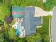 Lovely aerial view of home with backyard oasis including pool, basketball court, and lush landscaping at 123 Trellingwood Dr, Morrisville, NC 27560
