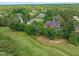 Aerial view of property backing onto a golf course with a beautiful pool at 123 Trellingwood Dr, Morrisville, NC 27560