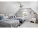 Bright bedroom with twin beds, ample natural light, and a cozy reading nook at 123 Trellingwood Dr, Morrisville, NC 27560