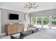 This bedroom features a dresser, sitting chair, and lots of natural light at 123 Trellingwood Dr, Morrisville, NC 27560