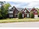 Beautiful brick home featuring manicured landscaping and a well-maintained lawn at 123 Trellingwood Dr, Morrisville, NC 27560