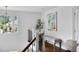 Bright hallway showcasing a bench, hardwood floors, and a window for plenty of natural light at 123 Trellingwood Dr, Morrisville, NC 27560