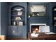 This office space includes custom shelving, a fireplace, and lots of natural light at 123 Trellingwood Dr, Morrisville, NC 27560