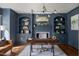 Stylish home office with custom built-ins, a cozy fireplace, and a sophisticated design at 123 Trellingwood Dr, Morrisville, NC 27560