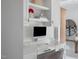 Modern office nook with sleek white desk, custom cabinets, and stylish decor at 123 Trellingwood Dr, Morrisville, NC 27560