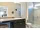 This bathroom features a walk-in shower, vanity, and neutral color palette at 1234 Sirius Drive Lot 31 Dr, Sanford, NC 27330