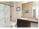 Well-lit bathroom with a shower-tub combo, modern fixtures, a large mirror, and granite counters at 1234 Sirius Drive Lot 31 Dr, Sanford, NC 27330