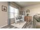 Bright dining area featuring modern table set, gray curtains, rustic decor, and stylish plank flooring at 1234 Sirius Drive Lot 31 Dr, Sanford, NC 27330