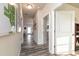 Inviting home hallway with wood-look floors, gray walls, white doors, and a wall map at 1234 Sirius Drive Lot 31 Dr, Sanford, NC 27330