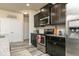 This lovely kitchen boasts stainless steel appliances, granite countertops, and dark wood cabinets at 1234 Sirius Drive Lot 31 Dr, Sanford, NC 27330