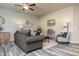 Cozy living room featuring stylish furniture, modern decor, a ceiling fan, and gray plank flooring at 1234 Sirius Drive Lot 31 Dr, Sanford, NC 27330