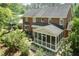 Aerial view of the backyard, showcasing the screened porch and surrounding landscaping at 126 Solterra Way, Durham, NC 27705