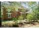 Spacious backyard featuring brick exterior and a screened-in porch addition at 126 Solterra Way, Durham, NC 27705