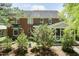 Charming brick home with a screened porch, landscaped yard, and mature trees at 126 Solterra Way, Durham, NC 27705