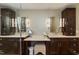 Elegant bathroom featuring double vanities, dark wood cabinets, and a convenient makeup vanity area at 126 Solterra Way, Durham, NC 27705