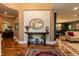 Elegant foyer with hardwood floors, decorative mirror, and open view to the living and dining areas at 126 Solterra Way, Durham, NC 27705