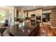 Beautiful kitchen featuring an oversized granite island, stainless appliances, and hardwood floors at 126 Solterra Way, Durham, NC 27705