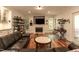 Spacious living room with fireplace, built-in shelves, and views of the outdoors at 126 Solterra Way, Durham, NC 27705