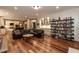 Expansive living room with hardwood floors, fireplace, built-in cabinets and an open layout at 126 Solterra Way, Durham, NC 27705