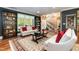 Warm living room featuring stairs, open floor plan, and built-in shelving at 126 Solterra Way, Durham, NC 27705