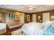 Comfortable main bedroom with warm lighting and a glimpse into an adjoining bathroom at 126 Solterra Way, Durham, NC 27705