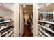 Spacious walk-in closet with ample shelving and storage options for shoes, accessories, and clothing at 126 Solterra Way, Durham, NC 27705
