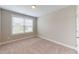 Cozy bedroom featuring a large window for natural light, carpet flooring, and neutral paint at 150 Hanover Ct, Clayton, NC 27527