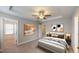 Comfortable bedroom featuring a ceiling fan, carpet, and neutral paint, creating a serene atmosphere at 150 Hanover Ct, Clayton, NC 27527