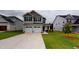 Charming two-story home with a two-car garage and well-maintained lawn, perfect for families at 150 Hanover Ct, Clayton, NC 27527