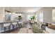 Bright and airy living space with a modern kitchen, dining area, and comfortable seating arrangement at 150 Hanover Ct, Clayton, NC 27527