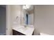 Bathroom vanity featuring a white countertop, stainless steel faucet, and dark wood cabinetry at 150 Hanover Ct, Clayton, NC 27527
