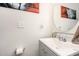 Charming half bathroom featuring a modern vanity with an attractive mirror at 150 Sherrill Place Ln, Garner, NC 27529