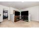 Upstairs bonus room featuring two televisions and plenty of space at 150 Sherrill Place Ln, Garner, NC 27529