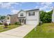 Attractive two-story home with a neatly kept lawn, a two-car garage and welcoming curb appeal at 150 Sherrill Place Ln, Garner, NC 27529