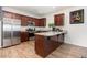 Well-equipped kitchen featuring stainless steel appliances, granite countertops and wooden cabinets at 150 Sherrill Place Ln, Garner, NC 27529