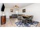 Inviting living area featuring a cozy gray sectional, ceiling fan, and an adjacent dining space at 150 Sherrill Place Ln, Garner, NC 27529
