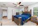 Spacious main bedroom with a ceiling fan, natural light, and a matching dresser at 150 Sherrill Place Ln, Garner, NC 27529