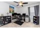 Home office featuring multiple computer screens, ceiling fan, and lots of storage, ideal for productivity at 150 Sherrill Place Ln, Garner, NC 27529