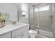 Modern bathroom features a glass-enclosed shower, vanity, and contemporary fixtures at 1515 Tamarisk Ln, Durham, NC 27703