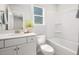 Well-lit bathroom featuring a vanity, toilet, and tub with shower, designed for comfort at 1515 Tamarisk Ln, Durham, NC 27703