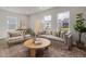 Inviting living room with hardwood floors, natural light, and contemporary furniture at 1515 Tamarisk Ln, Durham, NC 27703