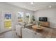 Cozy living room features hardwood floors, large windows, and stylish furniture at 1515 Tamarisk Ln, Durham, NC 27703