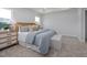 Calm primary bedroom featuring soft carpet, natural light, and neutral decor at 1515 Tamarisk Ln, Durham, NC 27703